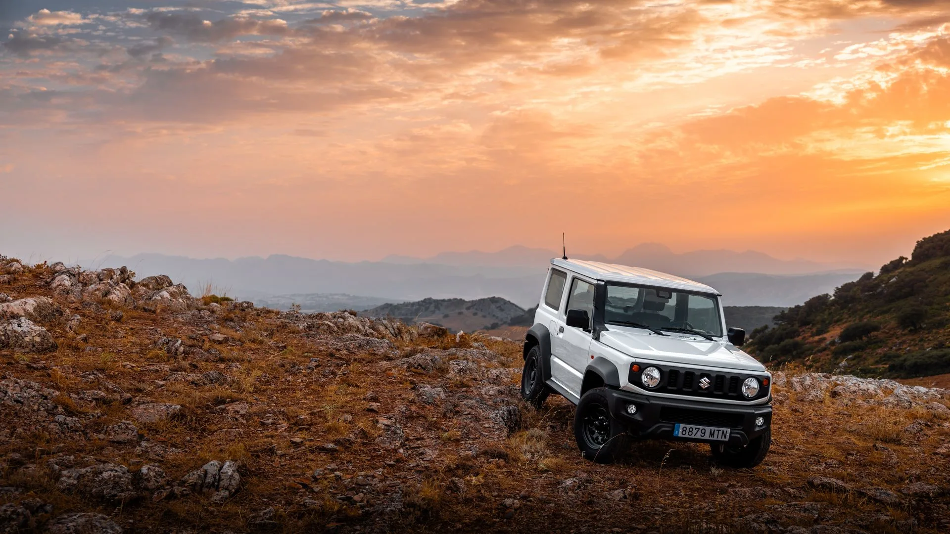 4x4 Jeep adventure on a Mykonos cliff road at sunset